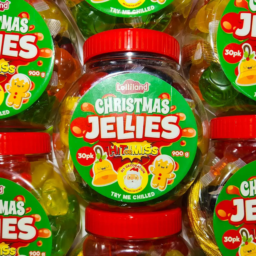 Jar of Christmas Jellies with a red lid surrounded by other similar jars.
