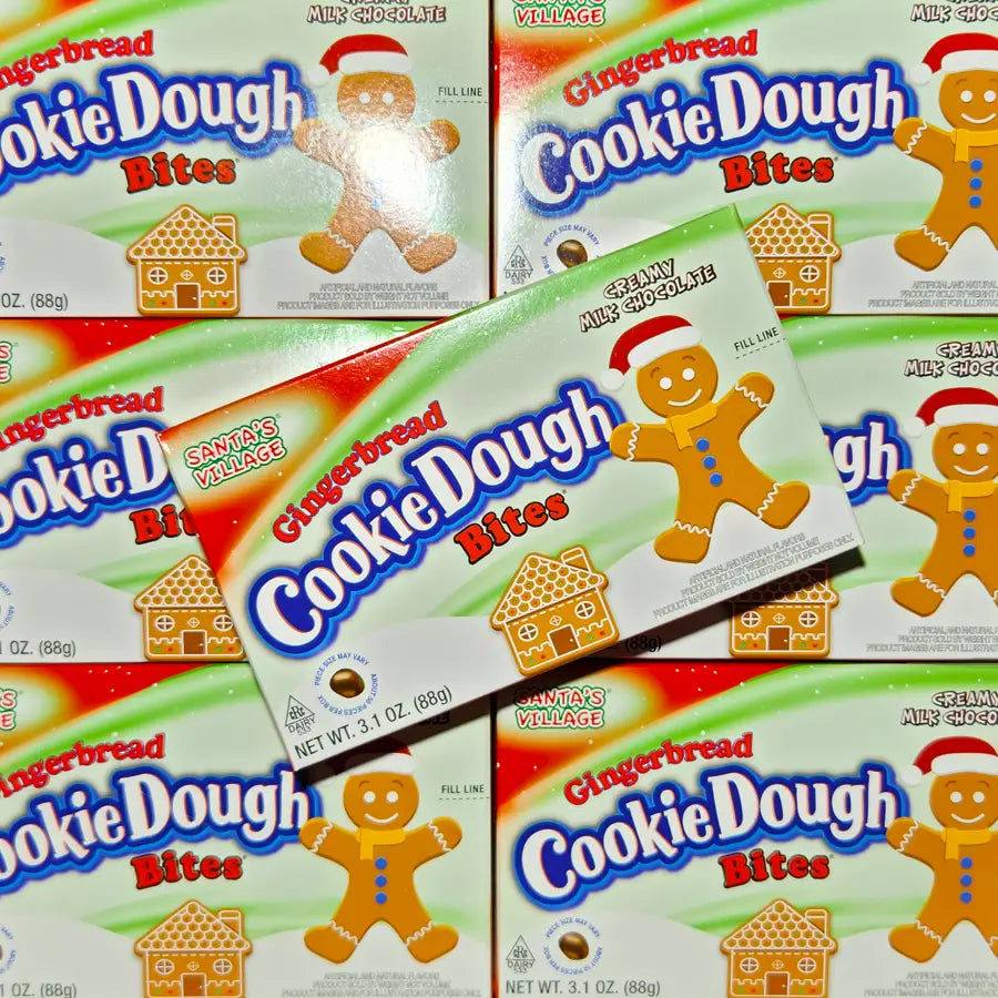 Multiple boxes of Gingerbread Cookie Dough Bites with a gingerbread man and house design on the packaging.