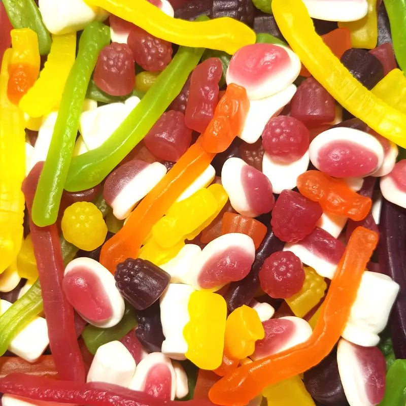 Assorted colorful gummy candies, including snakes and fruit shapes