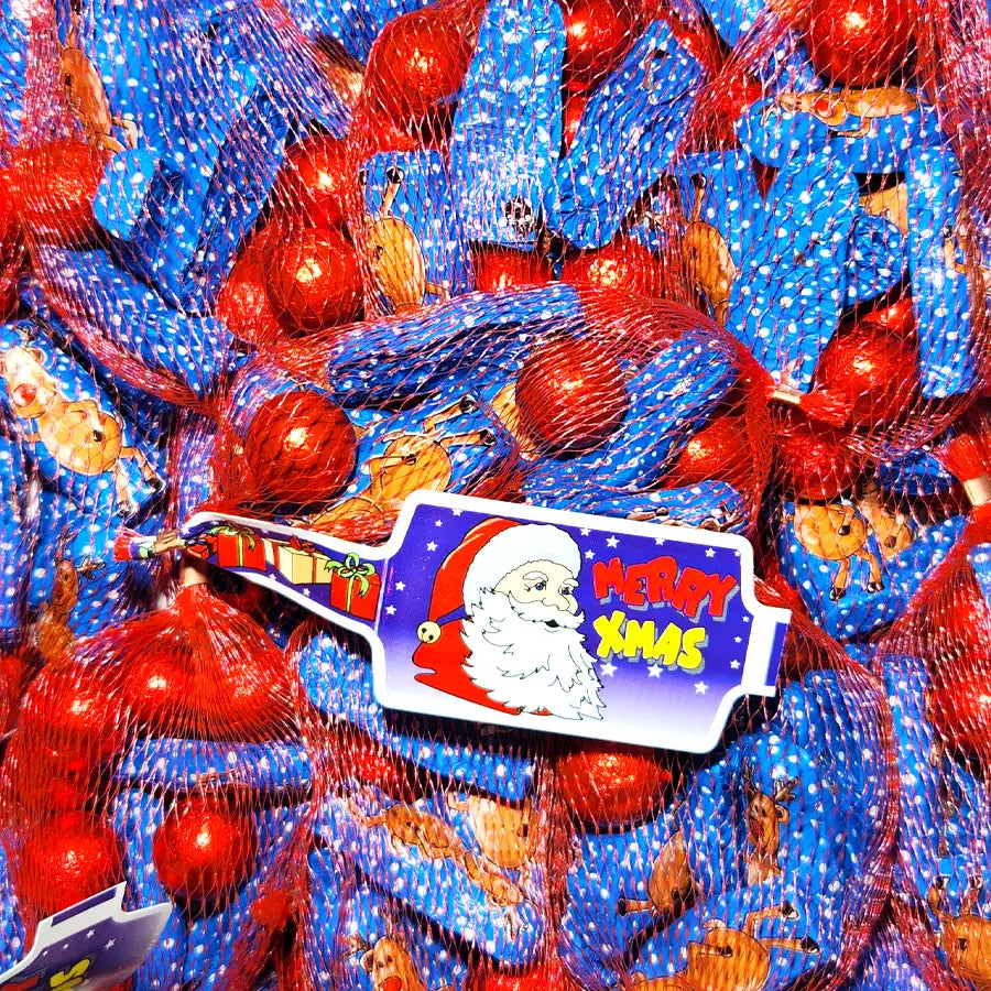 Blue and red reindeer shaped chocolates with a foil wrap in a red net bag
