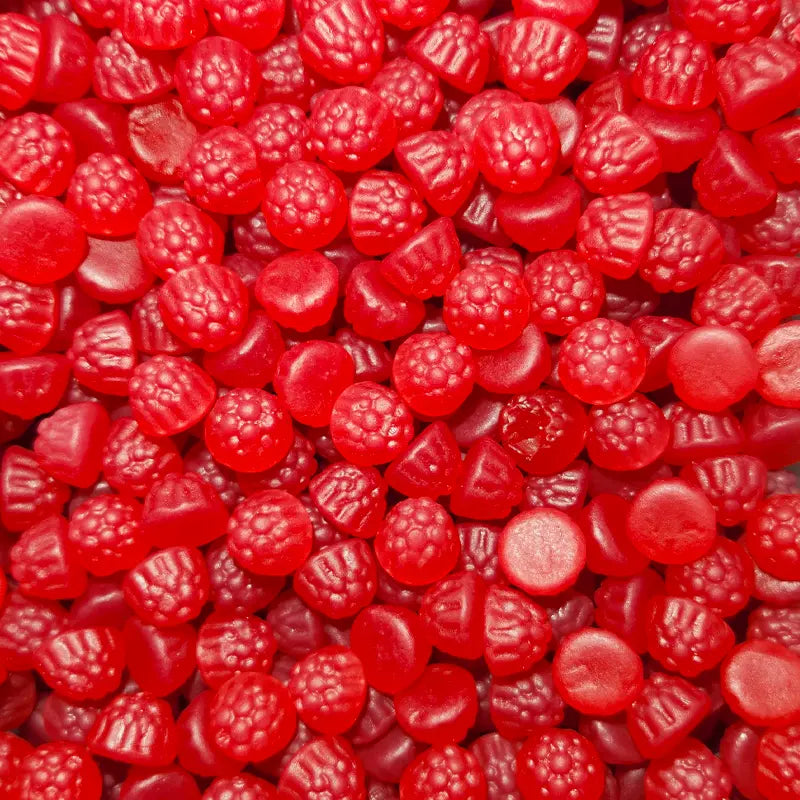 A close-up image of bite-sized red raspberry flavored candies.