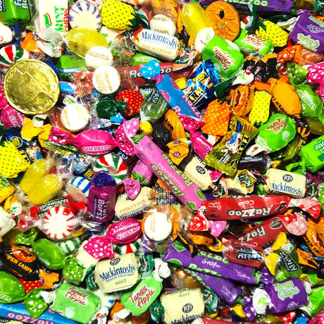 Wrapped lollies collection banner featuring colourful individually wrapped fruit burst and mint chew lollies on a white background for Candy Co New Zealand