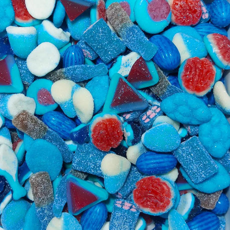 An enticing blend of blue and white candies, showcasing a close-up of a mix of blue lollies