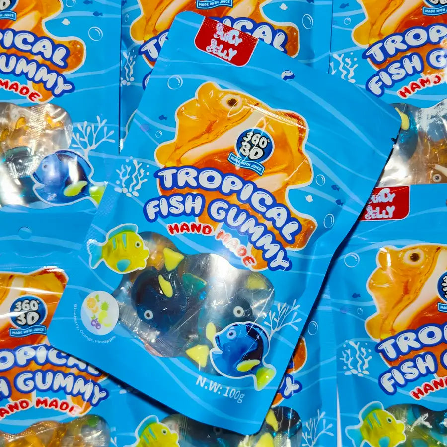 Multiple packages of Tropical Fish Gummy candy with blue wrappers and fish illustrations.