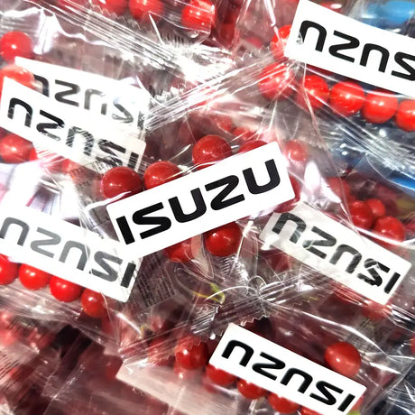 Branded bags of Jaffas with the Isuzu logo on the fronts