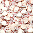 Close-up of white taffy candies in red and white wrappers. Bubblegum Flavour