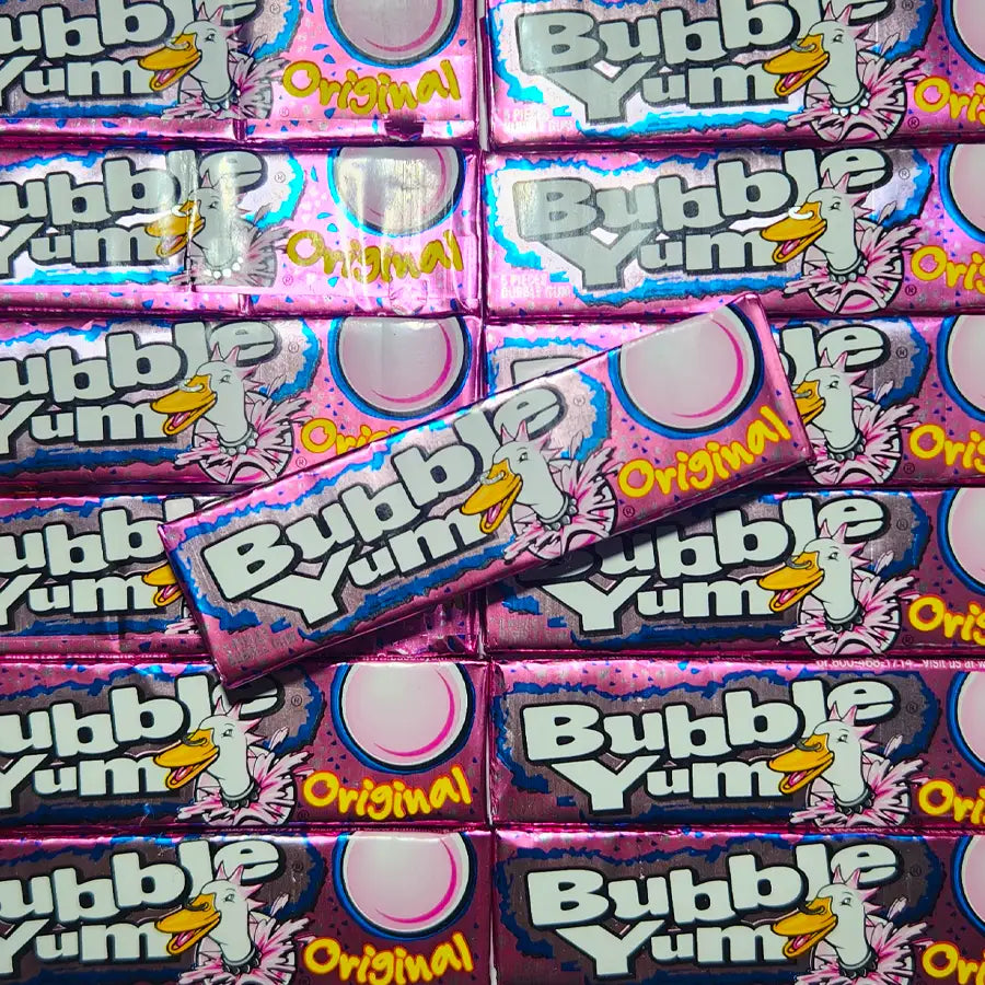 Multiple packages of Bubble Yum Original bubble gum with colorful pink packaging.