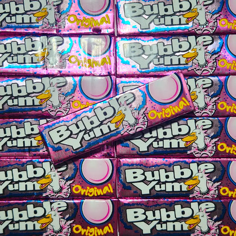 Multiple packages of Bubble Yum Original bubble gum with colorful pink packaging.