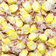 Yellow and white swirled candies in red and white wrappers. Popcorn and Butter falvoured