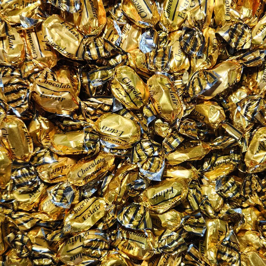 Close-up of gold-wrapped chocolates with "ecliar" branding and chocolate flavour