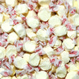 Close-up of white taffy candies with red text on clear wrappers. Eggnog Flavour