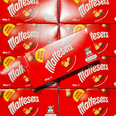 Stack of red Maltesers chocolate boxes with visible branding. 60 grams in size.