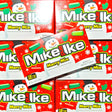 Multiple boxes of Mike and Ike Merry Mix candy with snowman design on a red background.