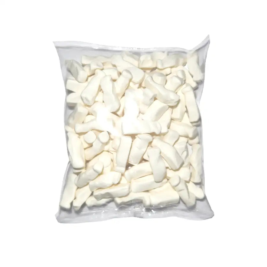 Clear plastic bag filled with white milk bottle shaped candies on a white background