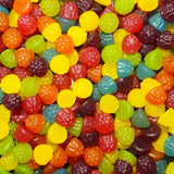 A variety of colorful gummy candies shaped like different berries, including what appears to be blackberries and raspberries.