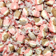 Assorted pink, white, and brown taffy candies in red and white wrappers. Neapolitan flavoured taffy