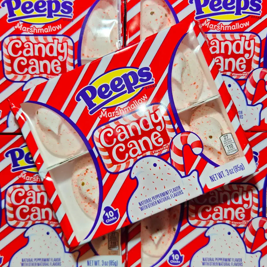 Multiple packages of Peeps Candy Cane flavor marshmallow chicks on a red background.