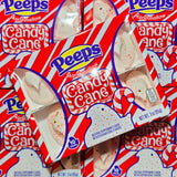 Multiple packages of Peeps Candy Cane flavor marshmallow chicks on a red background.