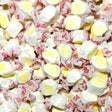 Assorted taffy candies with white, yellow, and red colors. Pina Colada Flavour