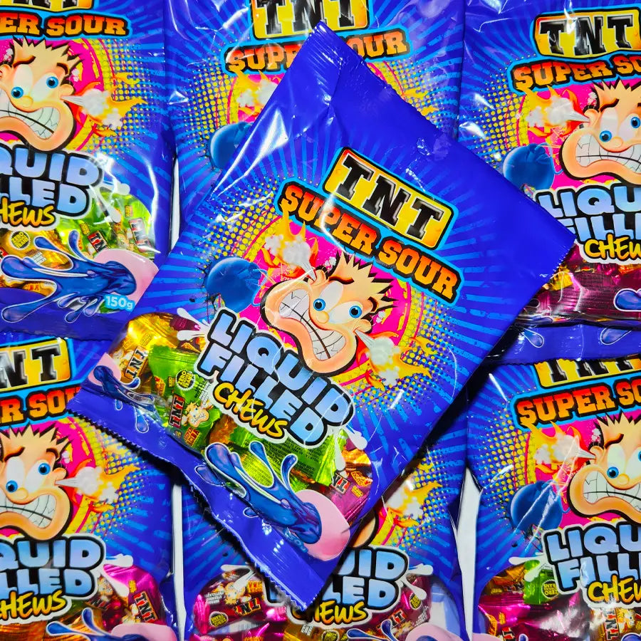 Multiple packages of TNT Super Sour Liquid Filled Chewy candies in a 150 gram sized bag