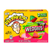 A box of Warheads Wedgies Theater Box 99g showing the product name and watermelon-shaped gummy candies on the front.